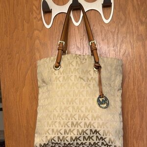 Michael Kors Cream Tote with Signature MK Logo and Leather Handles. Make Offer